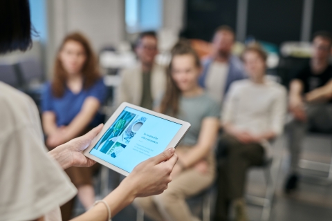 Person leading a learning session from tablet